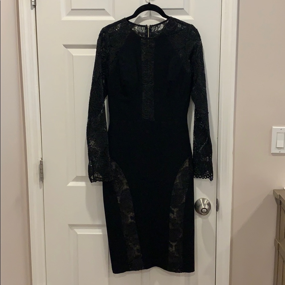 Black long sleeve dress with lace sleeves.